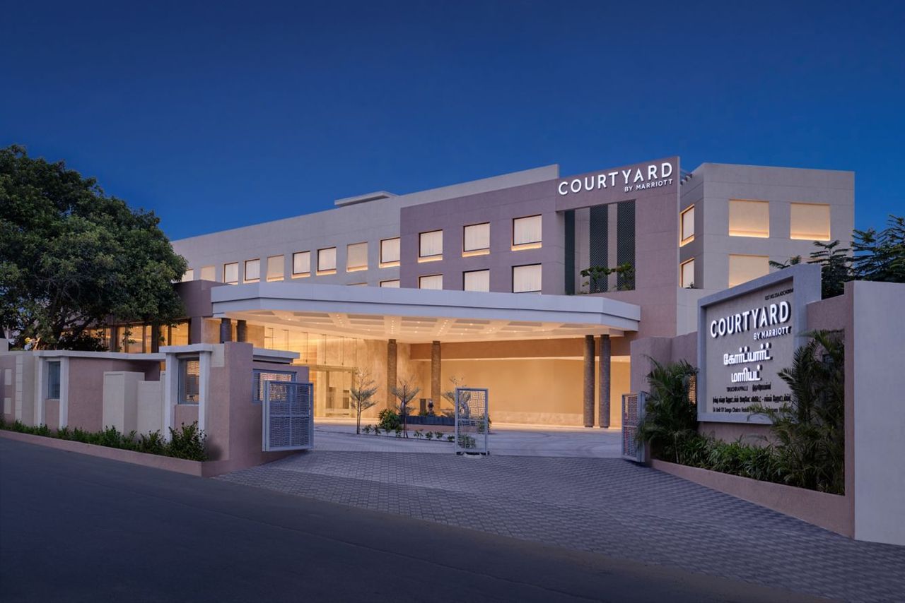 Courtyard by Marriott Tiruchirappalli facade lit at dusk